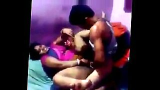 two guys licking one girls boobs in train